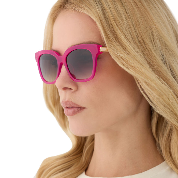 on model - female wearing diff eyewear featuring the bella square sunglasses with a bright tulip with gold frame and grey gradient lenses angled view