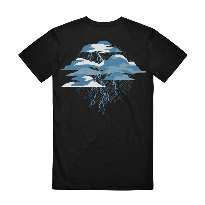 The Sleep On It Falling Further Faster T-Shirt in black features layered blue and white cloud graphics with lightning bolts on the back, set against a dotted circular design—ideal for any fan of the band.