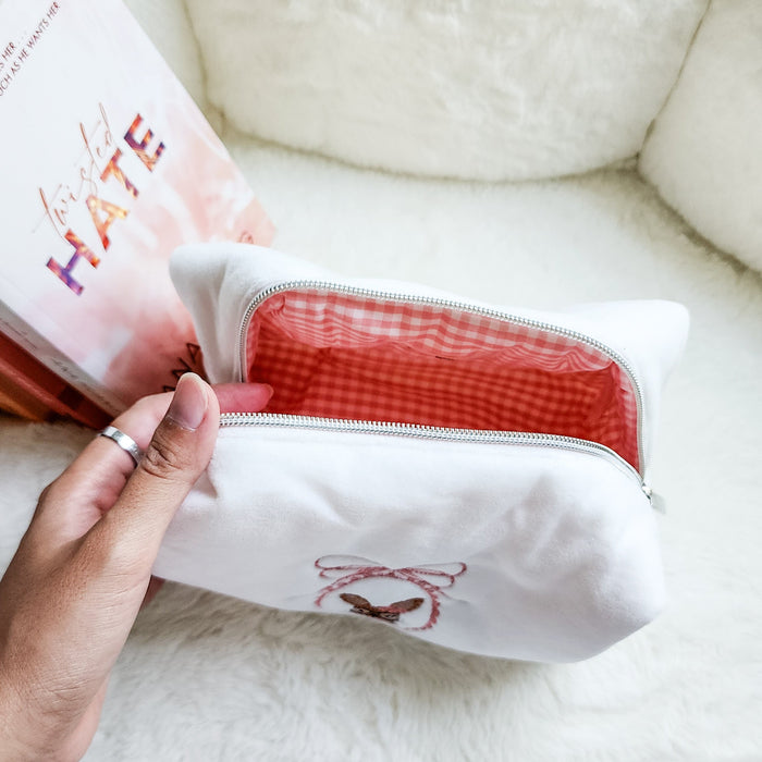 Little Rabbit and Her Book Zippered Pouch | Bookish Makeup & Reading Accessories Bag - The Bean Workshop - book girlie, bookish gift, bookish pouch, bow, coquette, coquette aesthetic, embroidered pouch, gift for book lovers, kindle bag, makeup bag, quilted pouch, rabbit book bag, reading accessories, reading accessories bag, zipper pouch