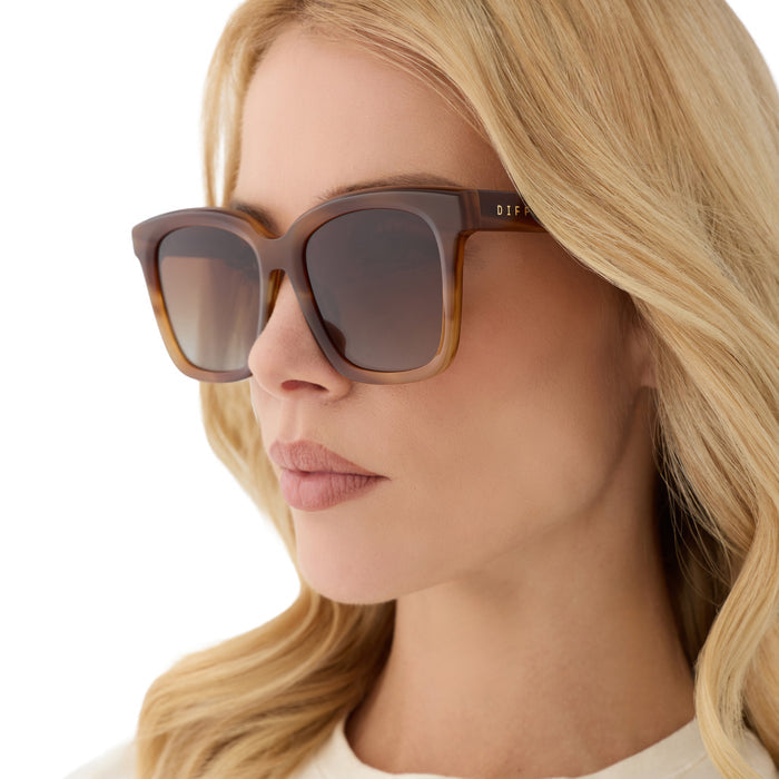 on model - blonde female wearing diff eyewear featuring the meredith square sunglasses with a tawny brown tortoise frame and brown gradient polarized lenses angled view