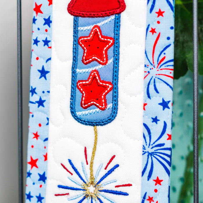Decorative ribbon with red stars and blue fireworks on a white background