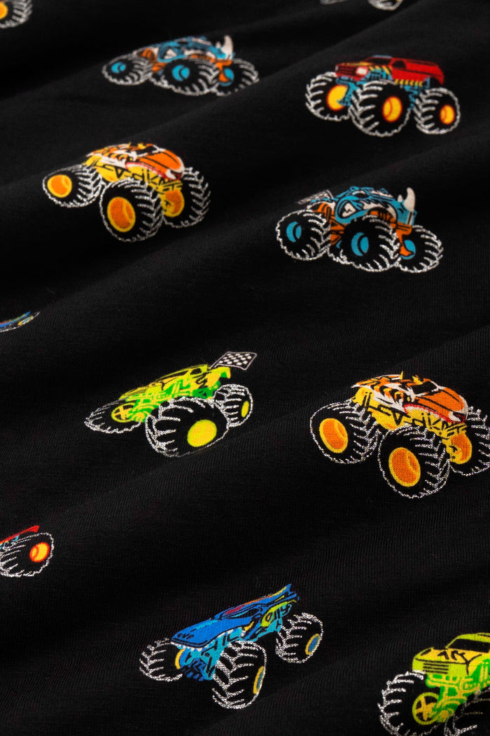 Close up of colorful monster truck print on black fabric