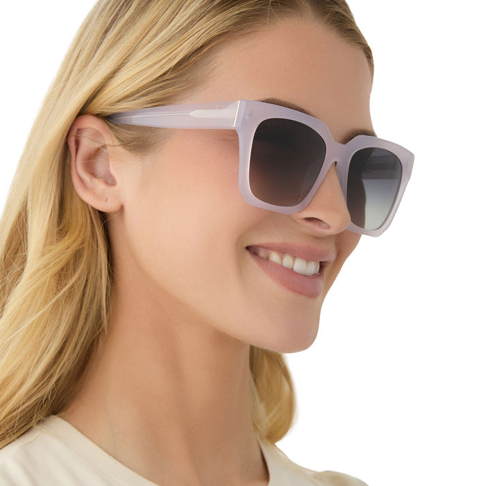 on model - female wearing diff eyewear featuring the ariana oversized square sunglasses with a thistle frame and grey gradient lenses angled view