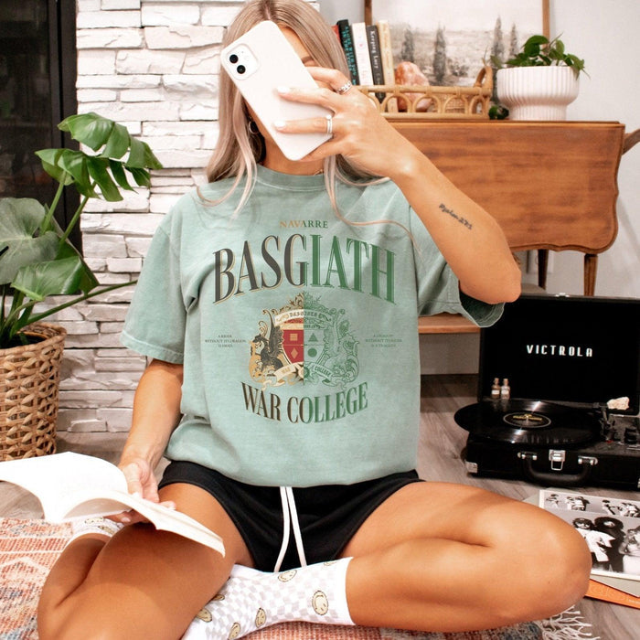 Basgiath War College Tee Shirt - The Bean Workshop - Basgiath War College Half and Half T-Shirt Empyrean Fan, BookTok Bookstagram Outfit Idea, box tee, Crimson Gold Green Crest Design, Dark Academia Aesthetic, Dragon Rider Dual Tone Graphic, Dragon Rider Split Colorway Bookish Graphic Tee Fantasy Gift, Empyrean Fandom, Everyday Fandom Casual Wear, fourth wing, Navarre War College Statement Tee, rebecca yarros, Split Colorway Heraldic Style