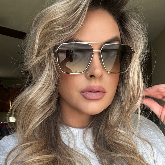 lifestyle - music mellie wearing silver metal framed navigator sunglasses