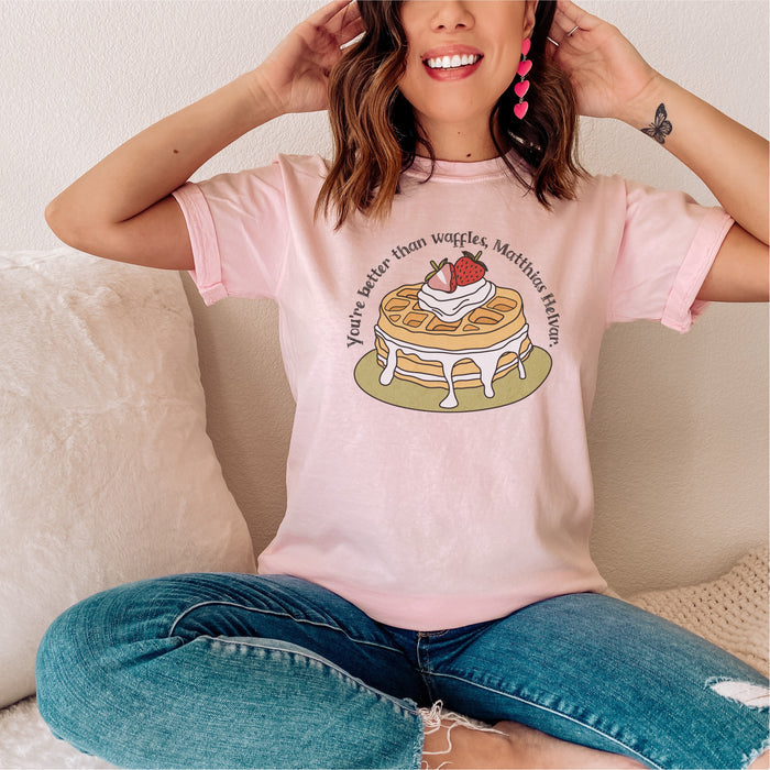 Better Than Waffles T-Shirt - The Bean Workshop - Better than Waffles shirt, Book Lover Gift, Bookish T-shirt, Cozy Aesthetic, Cute Graphic Tee, Grishaverse gift, Helnik, Leigh Bardugo fan apparel, Literary Quote, Matthias Helvar merch for readers, Nina Zenik waffle quote shirt, Six of Crows t-shirt, Waffle Illustration