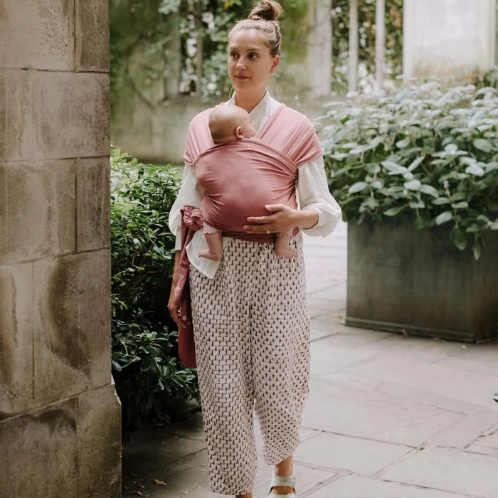 A Boba Classic Baby Wrap, made from a soft 95% French Terry cotton blend and 5% Spandex. Ergonomic, award-winning design fits babies from 7 Ibs to 35 Ibs, best up to 20 Ibs. Machine washable, dryer friendly, and certified hip-healthy. Dusty Pink