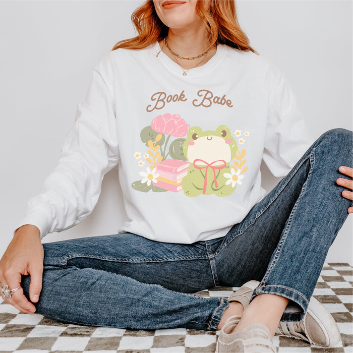 Book Babe Fleece Crewneck Sweatshirt - The Bean Workshop - Autumn Fashion, Book Babe Sweatshirt, Bookish Merch, Bookstagram, Cozy Lifestyle, Frog and Books, Kawaii Aesthetic, Minimalist Design, Pastel Literary Loungewear, Reader Gift, Soft Girl Frog Reading Crewneck, Sweatshirt, The Bean Workshop