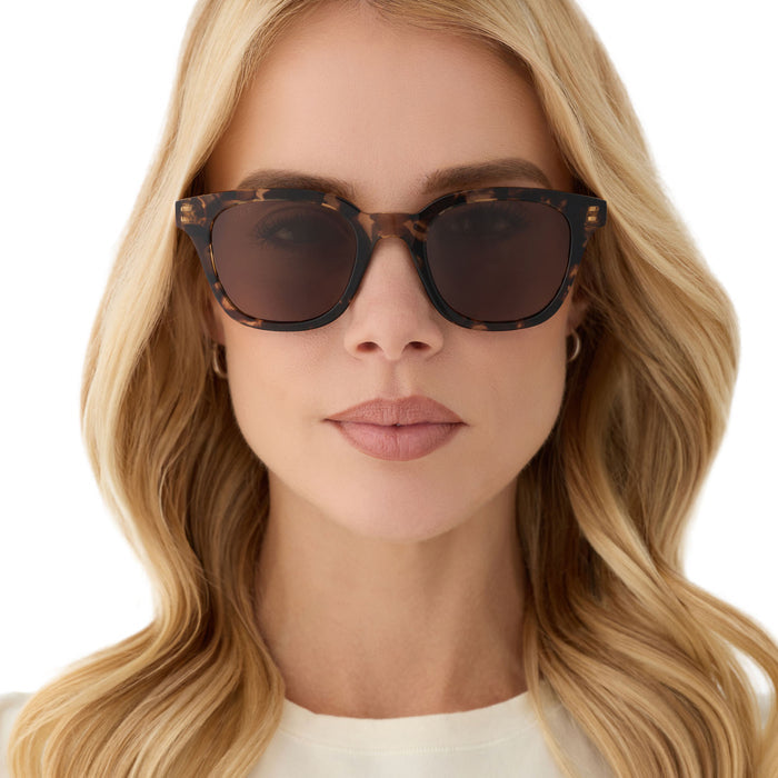 on model - female wearing diff eyewear featuring the bridget round sunglasses with a espresso tortoise frame and brown polarized lenses front view