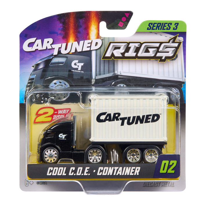 A packaged Carttuned Rigs diecast metal toy truck, featuring a black cab and a white container trailer with the Carttuned logo, in its original blister card packaging.