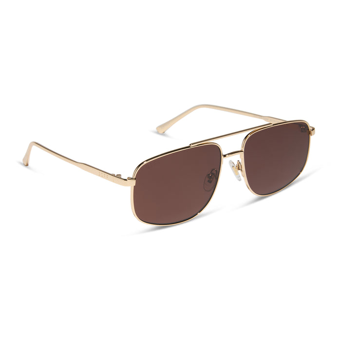 diff eyewear featuring the charley navigator sunglasses with a gold metal frame and brown polarized lenses angled view