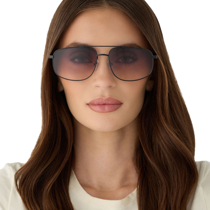 on model - female wearing diff eyewear featuring the charley navigator sunglasses with a shiny black metal frame and twilight gradient lenses front view