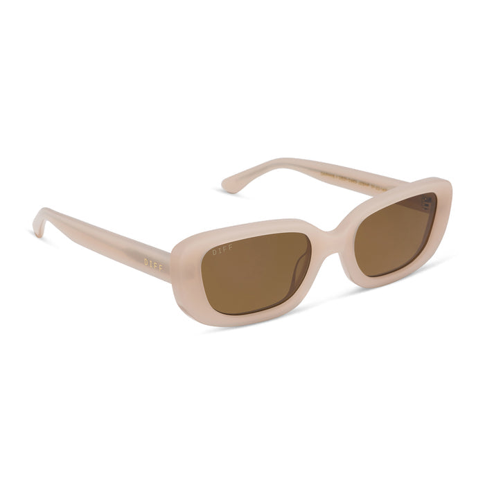 diff eyewear featuring the daphne ii rectangle sunglasses with a milky blush acetate frame and brown polarized lenses angled view