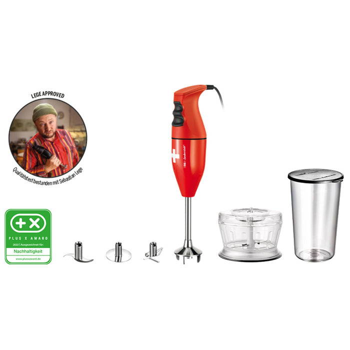 Der Unold ESGE-Zauberstab Bundle E 120 Select Rot ist ein roter Stabmixer mit Aufsätzen, Zerkleinerungsschale und Messbecher. Mit Zertifizierungsplakette, Logo des Nachhaltigkeitspreises und einem Mann, der im Hintergrund den Daumen nach oben zeigt.