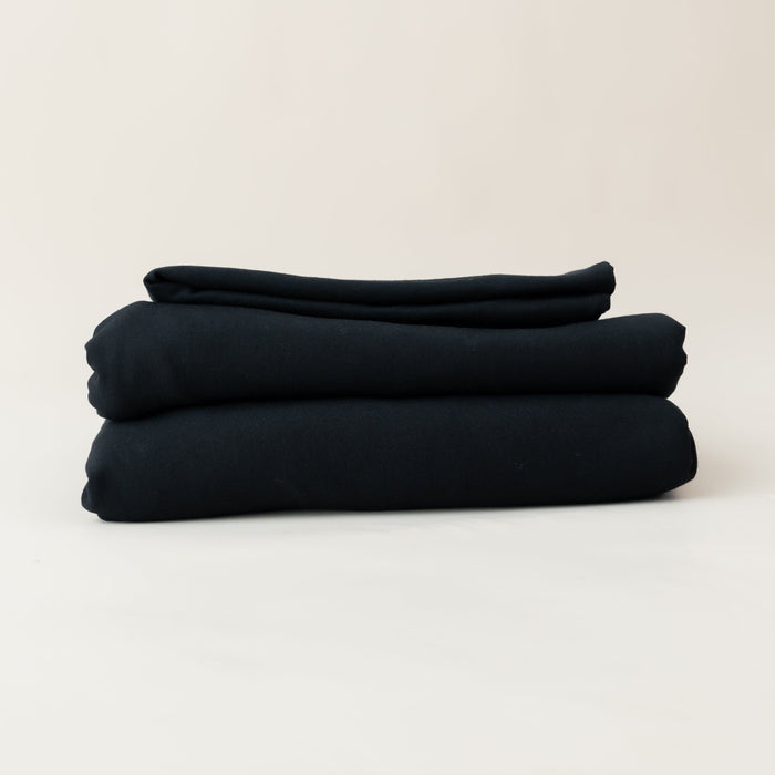 Folded Kyte Baby Fitted Sheet with Pillowcases in Midnight