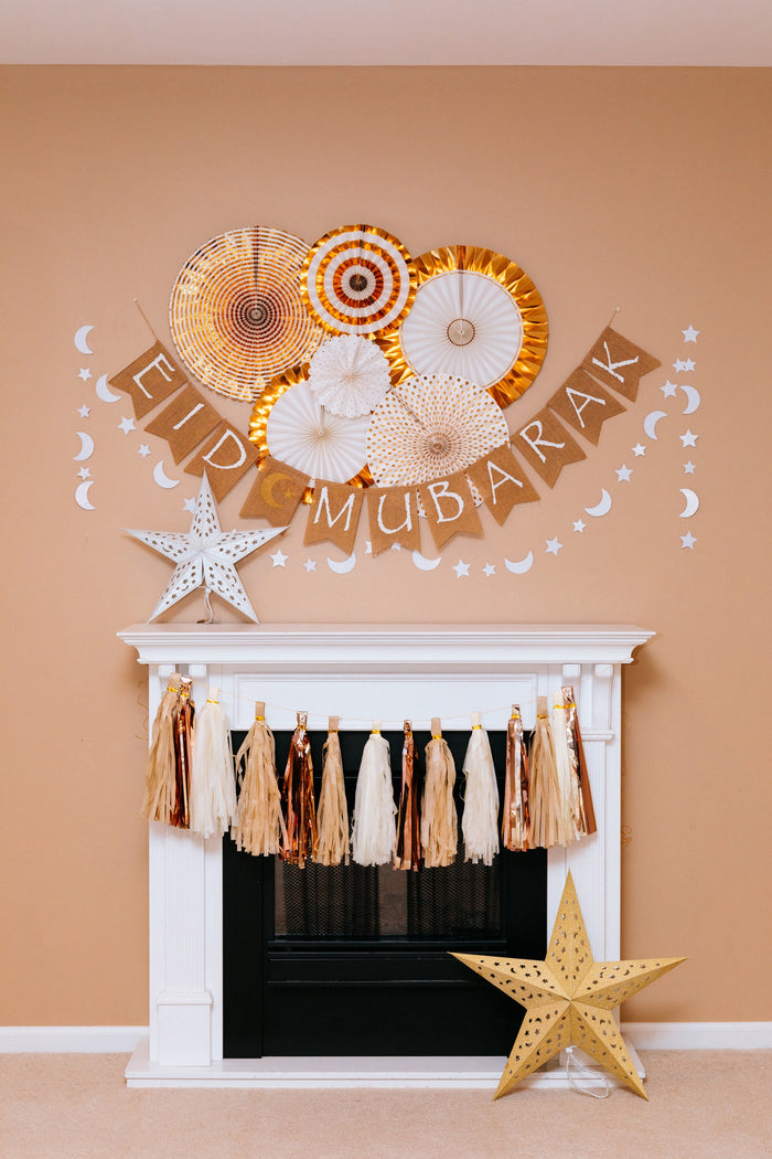 Gold and white garlands and Eid mubarak banner