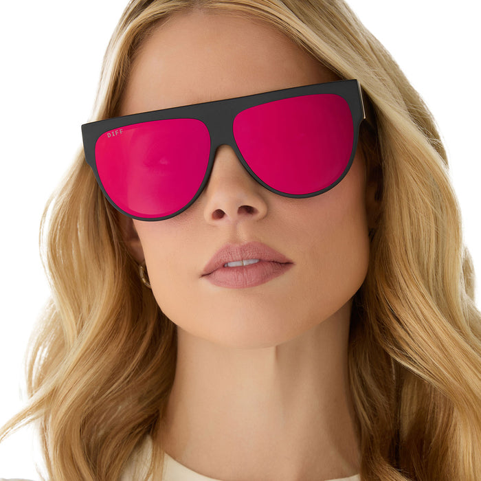on model - female wearing diff eyewear featuring the georgie square oversized sunglasses with a matte black frame and red hot summer mirrored lenses front view
