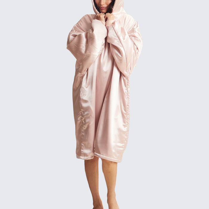 Model wearing the Kitsch Glazey in Blush, a satin hooded robe designed for cozy comfort and overnight hair protection.