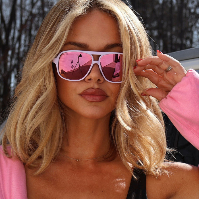 lifestyle - ashley smith blonde influencer wearing pink sweater and hangtime sunglasses