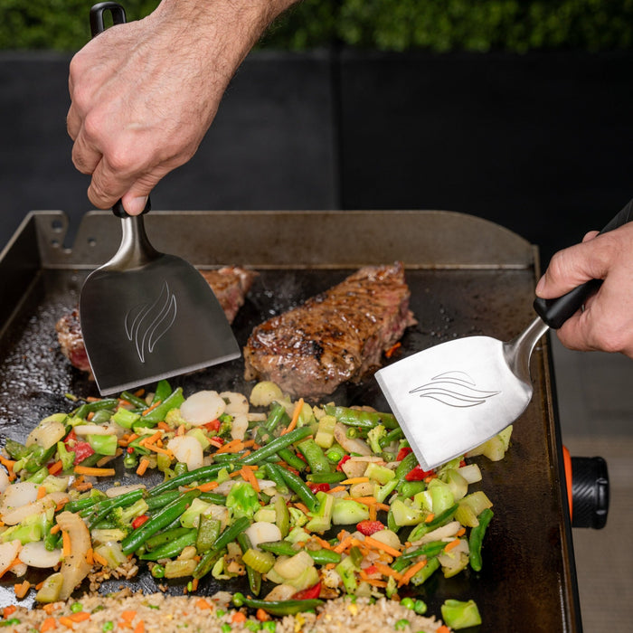 Use the hibachi spatulas to easily flip and move food on the griddle.