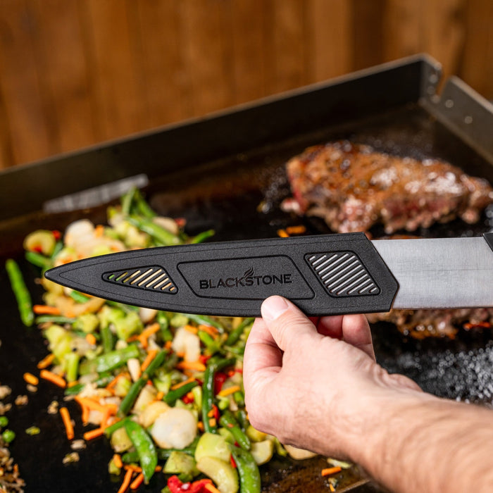The chef knife includes a protective sheath to keep the knife sharp and protected for storing.