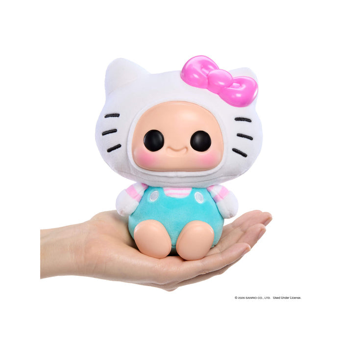 Toy figure with a Hello Kitty design held in a hand on a white background