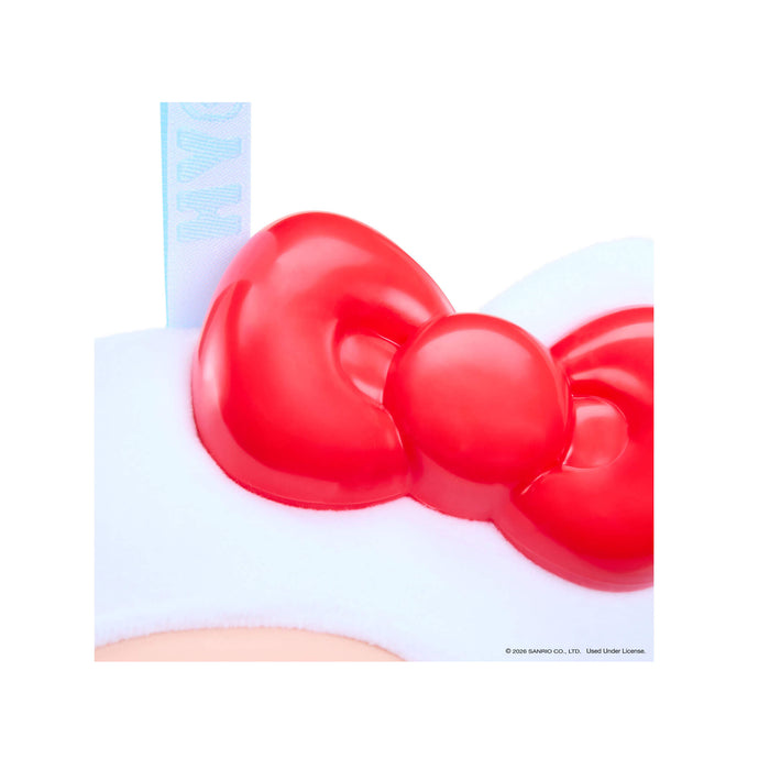 Red bow-shaped object on a white background