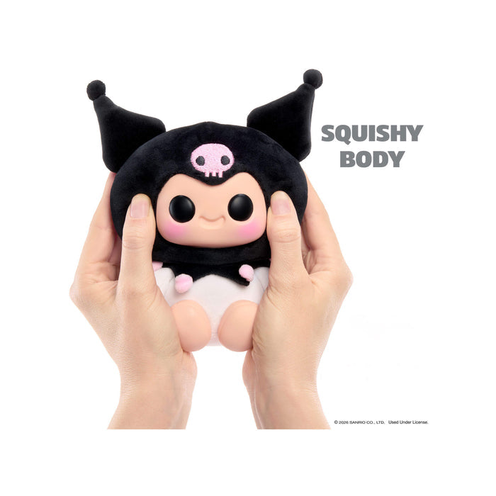 Squishy toy with black horns and pink face held by hands on a white background