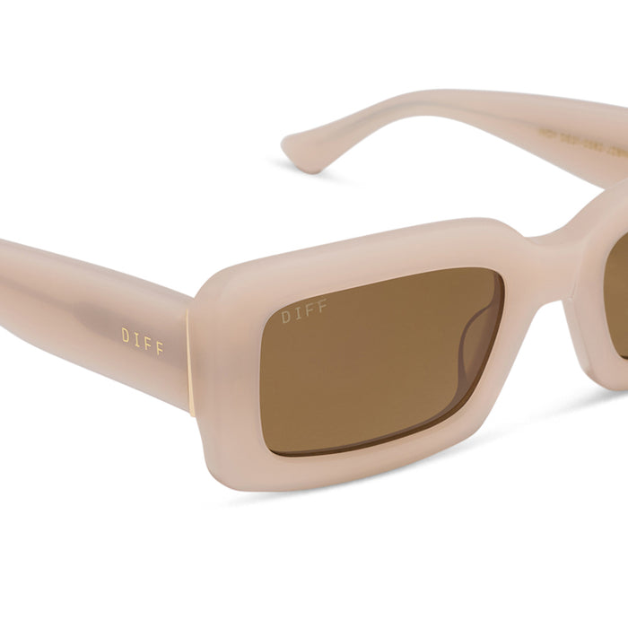 diff eyewear featuring the indy rectangle sunglasses with a milky blush acetate frame and brown polarized lenses detailed view