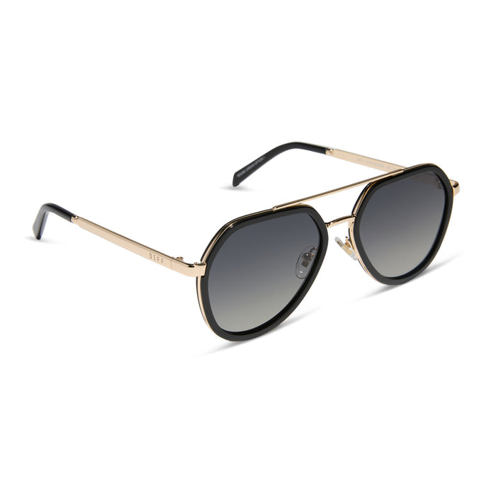 diff eyewear featuring the joey round sunglasses with a black & gold metal frame with grey gradient polarized lenses angled view