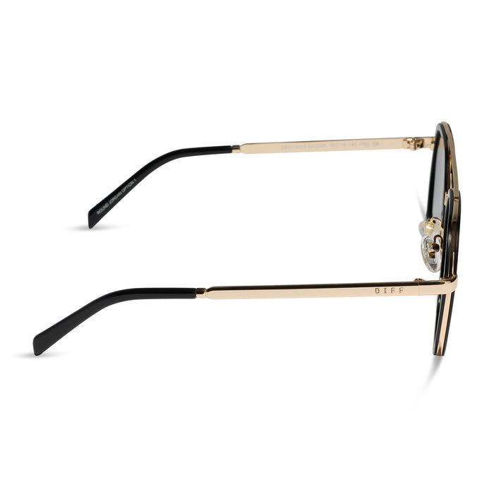 diff eyewear featuring the joey round sunglasses with a black & gold metal frame with grey gradient polarized lenses side view