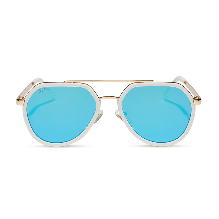 diff eyewear featuring the joey round sunglasses with a snowbound & gold metal frame with blue mirror lenses front view