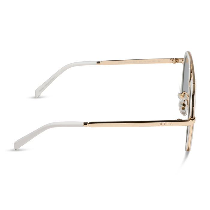 diff eyewear featuring the joey round sunglasses with a snowbound & gold metal frame with blue mirror lenses side view