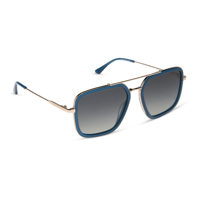 diff eyewear featuring the jordan navigator sunglasses with a clubhouse blue frame and gold metal with grey gradient polarized lenses angled view