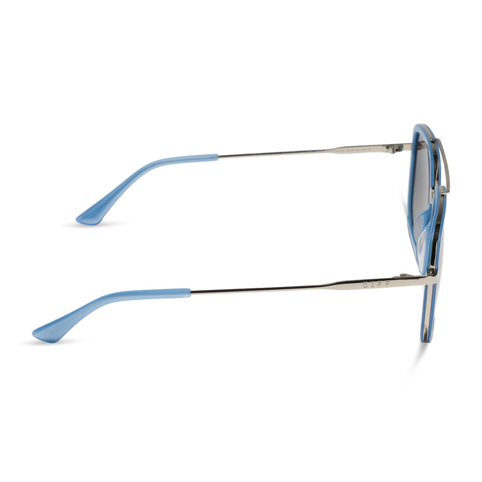 diff eyewear featuring the jordan navigator sunglasses with a light blue and silver frame with grey gradient polarized lenses side view