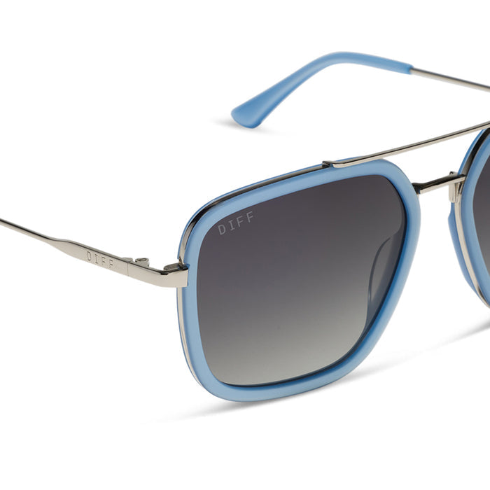 diff eyewear featuring the jordan navigator sunglasses with a light blue and silver frame with grey gradient polarized lenses detailed view