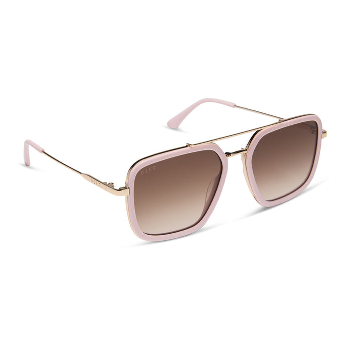 diff eyewear featuring the jordan navigator sunglasses with a powder pink with gold frame and brown gradient lenses angled view