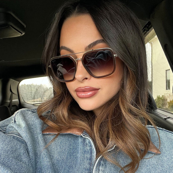lifestyle - alicia mya wearing jordan brown whiskey sunglasses with denim jacket