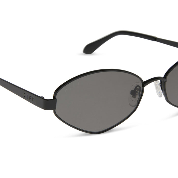 jojo fletcher x diff eyewear jordy cat eye sunglasses with a black metal frame and grey polarized lenses detailed view