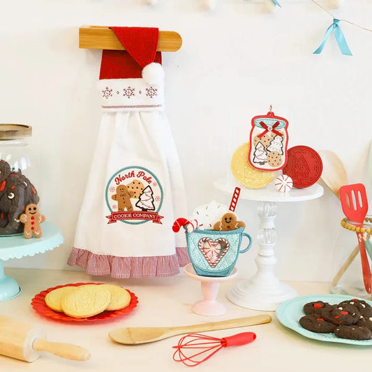 Decorative kitchen scene with a cookie-themed apron, baking utensils, and festive decorations.