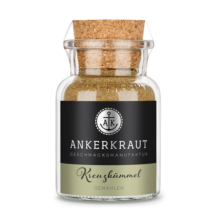 Kreuzkümmel Gemahlen von Ankerkraut im Korkenglas auf weißem Hintergrund.