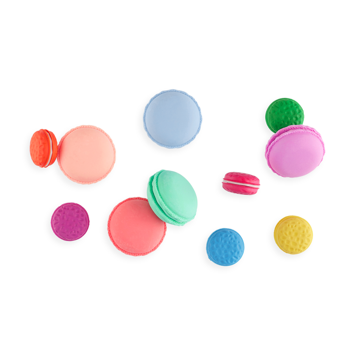 OOLY Le Macaron Patisserie Scented Erasers spread out on pages