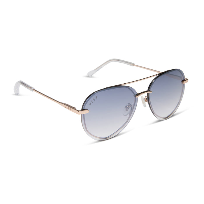 diff eyewear featuring the lenox xs aviator sunglasses with a champagne gold (light gold) frame and blue slate gradient with silver flash lenses angled view