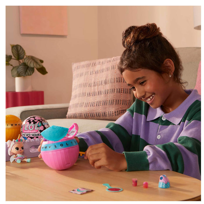 Girl opening a ball with a key in a home setting