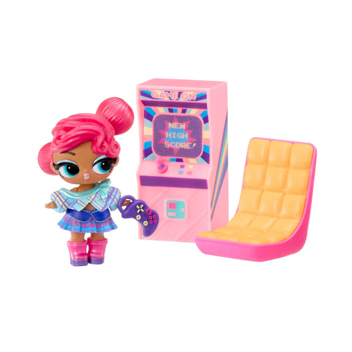 Toy figure with pink hair, pink and yellow chair, and colorful game machine on a white background