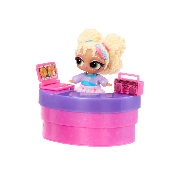 Toy doll with a purple and pink desk setup on a white background