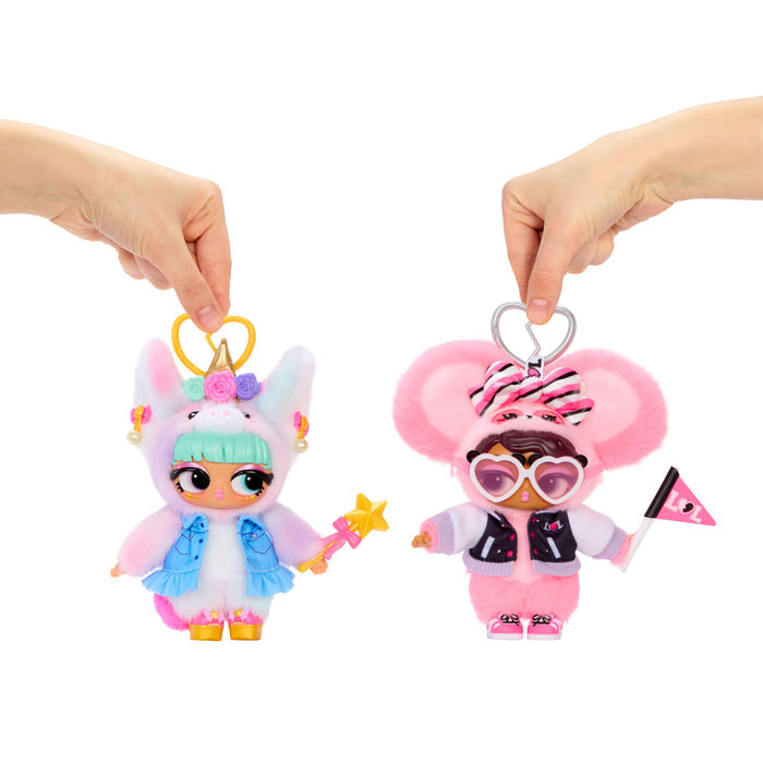 Two colorful keychains held by hands against a white background