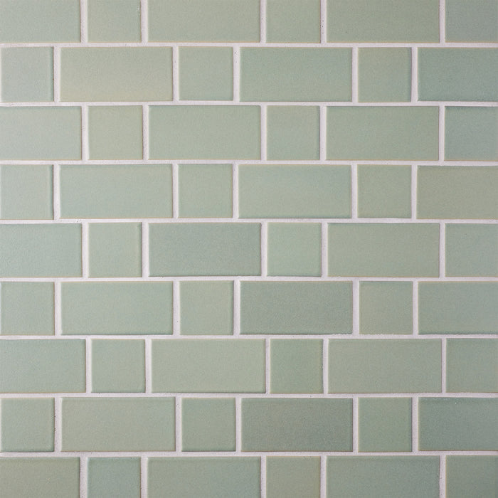 Caption: Classic Field 2x2, 2x4 in M119 Ogawa Green Manganese. Prism Driftwood grout by Custom Building Products