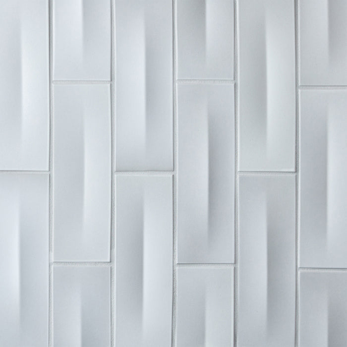 Caption: Dimensional Crease In & Dimensional Crease Out in M125 Moon. Prism Cape Grey grout by Custom Building Products.