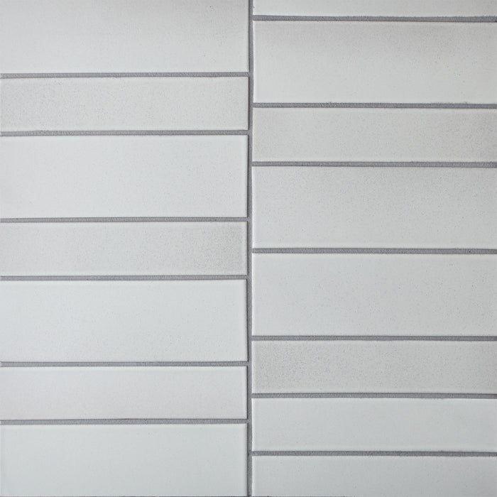 Caption: Classic Field 2x9 & 3x9 in M126 Alpine. Prism Pewter grout by Custom Building Products.